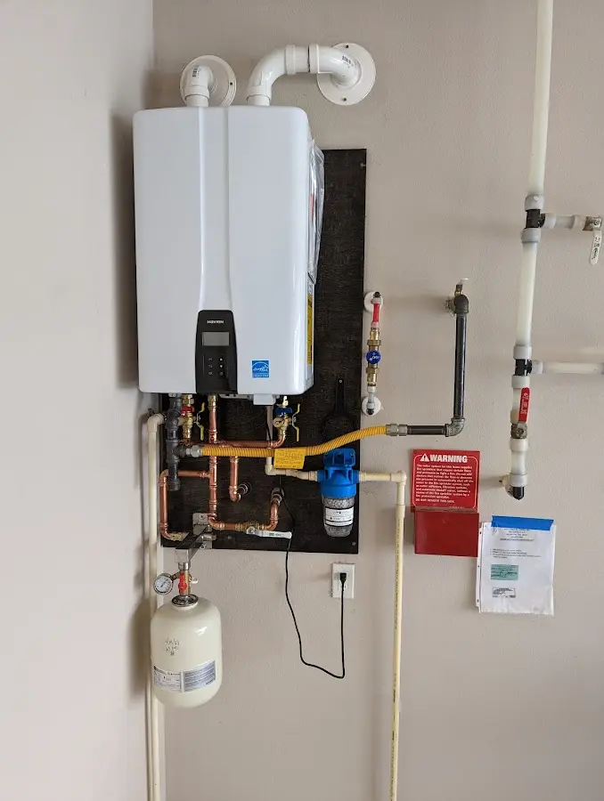 Professional plumber installing copper piping in a Pike Road home